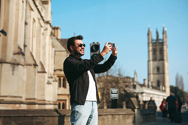 istock Young Man Walking along Oxford, UK 2213112179