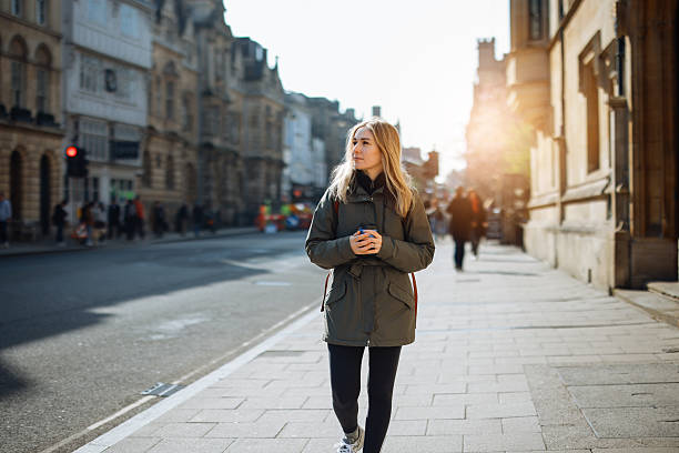 Young Woman Walking along Oxford, UK