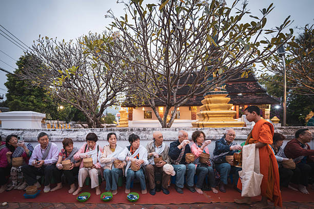 November 1 2024, Luang Prabang, Laos : People offer food to the monks in the morning.