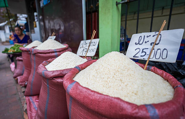 Luang Prabang, Laos - November 9, 2024：Sacks of white rice are displayed for sale at a market in Luang Prabang, Laos