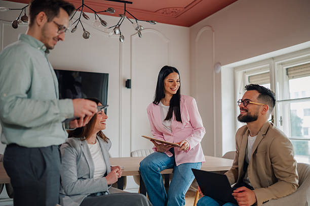 istock Young professionals collaborating on project in modern office 2213130057