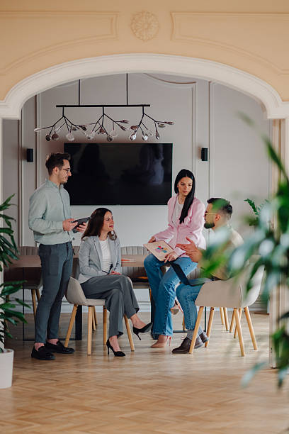 istock Young professionals collaborating on a project in a modern office 2213130073