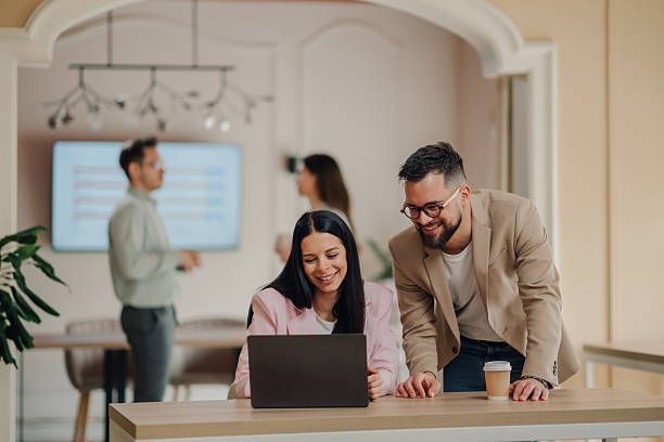 istock Business colleagues collaborating on laptop in modern office 2213130091