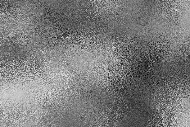 istock Silver soft gray foil texture glass effect background, gray platinum metallic texture. Silver gradient background. Foil paper, glitter effect. Chrome metal gray pattern. Gradation noise texture 2213133614
