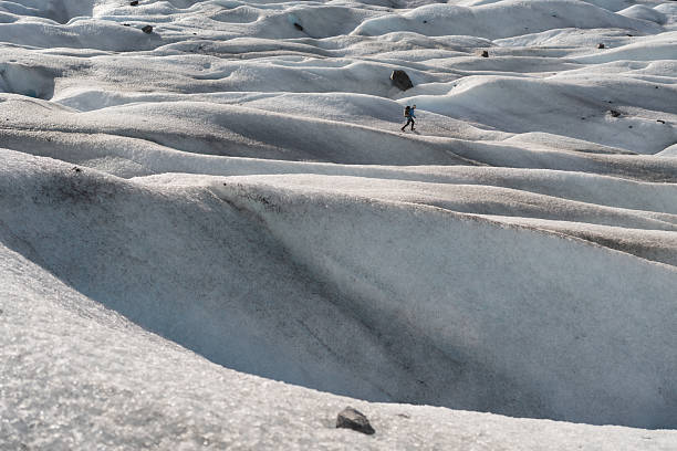 istock Mountaineer walking on a glacier in the sunlight 2213133822
