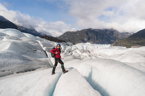 istock Female hiker exploring a glacier in patagonia 2213134990
