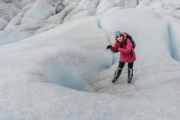 Glacier surface of  white and blue colored ice and dust, volcanic ash or soot particles deposited at terminus of the Perito Moreno Glacier near El Calafate, Argentina