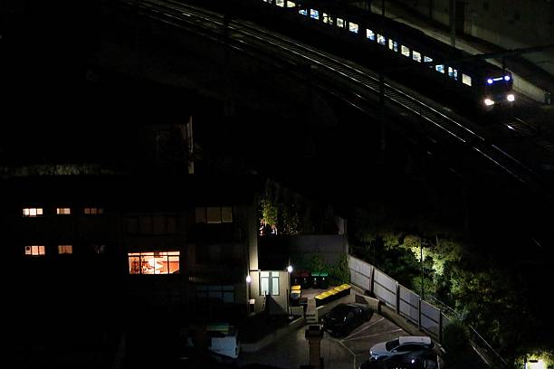 istock large light form a apartments window next to the morning commuter train 2213136958