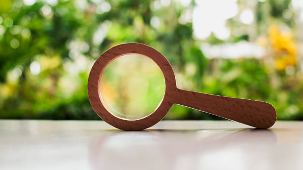 istock Close up Single Magnifying Glass with Black Handle, Business Analysis symbol, Searching for information concepts. 2213141564