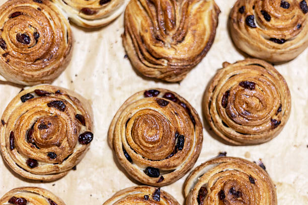 istock Freshly made cranberry and cinnamon buns, top view. 2213143417