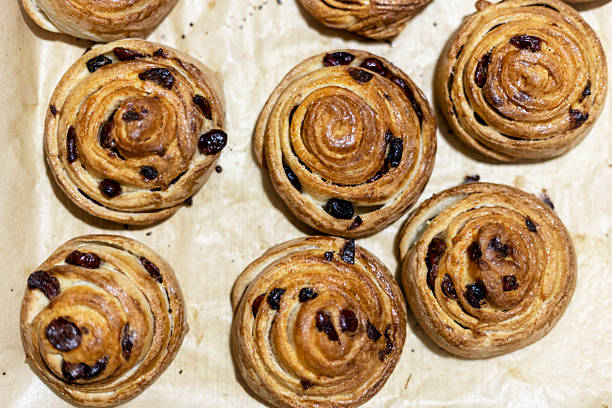 istock Freshly made cranberry and cinnamon buns, top view. 2213143442