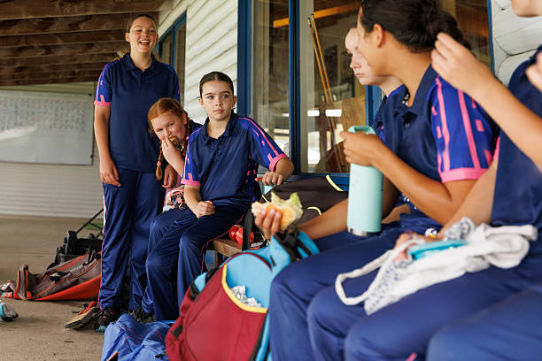 istock Group of female cricketers having a lunch break together 2213143615