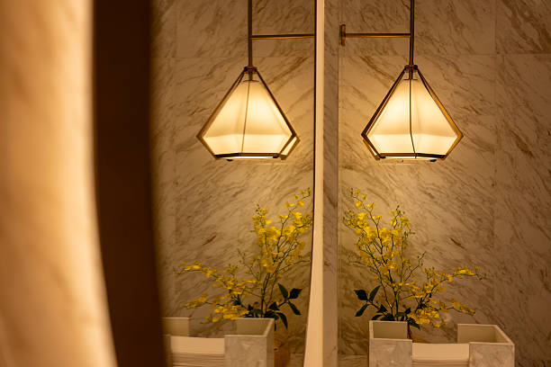 A sophisticated interior space featuring warm lighting, decorative vases, and elegant wall textures. The scene exudes a cozy and inviting atmosphere, ideal for showcasing home decor or design concepts.
