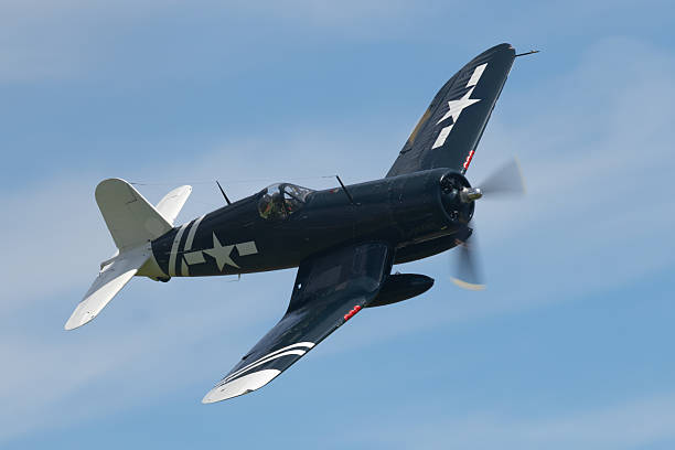 istock American WWII fighter plane (F4U Corsair )  approaching 2213150248