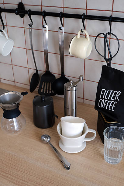 istock Ingredients and equipment for making coffee. Different ways to make alternative coffee - ceramic V60, glass Chemex, small teapot for brewing coffee, manual coffee grinder. Kitchen at home. 2213151291