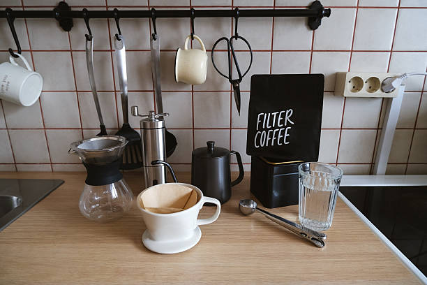 istock Ingredients and equipment for making coffee. Different ways to make alternative coffee - ceramic V60, glass Chemex, small teapot for brewing coffee, manual coffee grinder. Kitchen at home. 2213151370