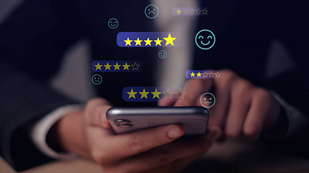 istock Customer user smartphone Feedback and Review Survey measuring Service Quality and Client Satisfaction with Star Ratings in a Digital Environment to Ensure a Happy Experience. 2213155680