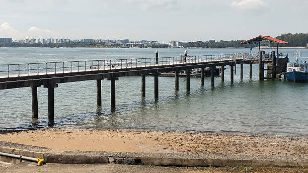 istock clear bright day at a jetty by the beach 2213155880