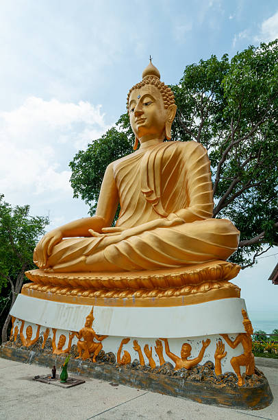 Golden Buddha statue in meditation pose at a temple, Ko Samui, Thailand