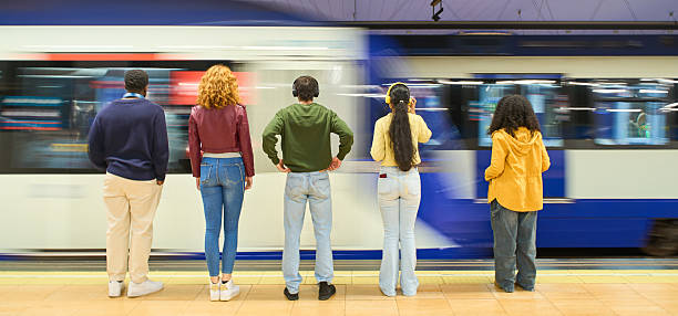 istock Young people waiting for arriving train in subway station 2213163907