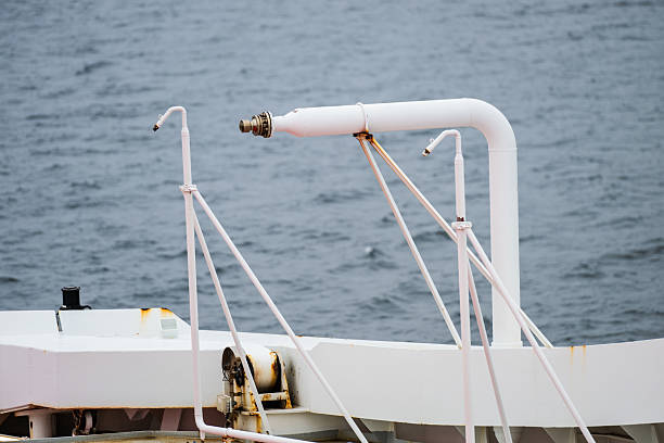 close-up of ship deck pipes and metal structures.