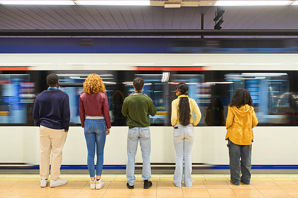 istock Young people waiting for arriving train in subway station 2213165408