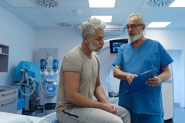 istock Doctor explaining CT scan results to patient in hospital setting 2213169358