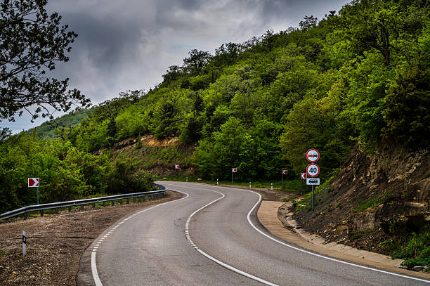 istock Road landscape forest, mountain and sea. 2213169453