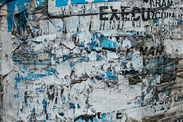 istock Ripped paper scraps on a poster pole, abstract textured backdrop 2213171801
