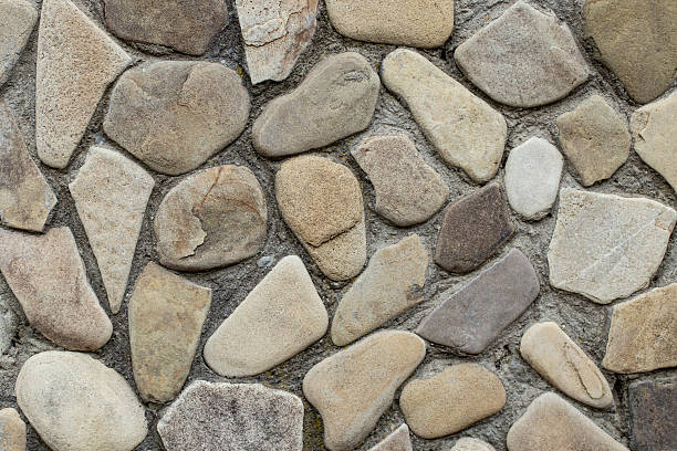 istock River stone wall stacked with cement structure, decorative stone mosaic, soft focus close up 2213171822