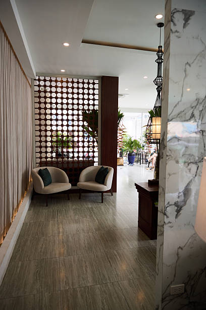 istock Modern interior with lounge chairs, decorative wall, and plants in a cozy setting 2213174916