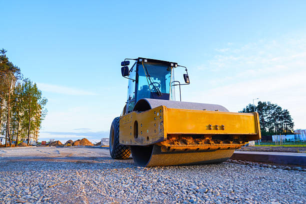 Soil Compactor for leveling ground during road construction. Soil Compactor for leveling ground during road construction. Road compaction equipment at construction site. Vibration single-cylinder road roller, Vibratory Soil Compactor. Single Drum Roller. flattening stock pictures, royalty-free photos & images