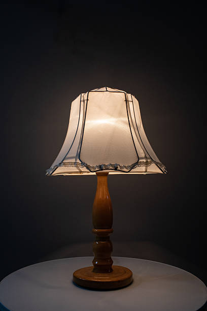 istock An Elegant Table Lamp featuring a Vintage Shade beautifully placed on a Stylish Table 2213180370