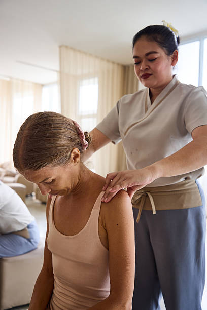 istock Professional therapist performing a relaxing shoulder massage in a calm spa setting 2213183012