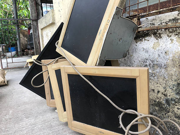San Pablo City, Laguna, Philippines-March 24, 2025: Old computer monitors that have been phased out are thrown out onto the sidewalk.
