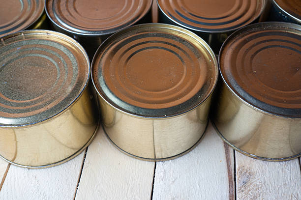 istock Round tin cans with food on the surface 2213190148