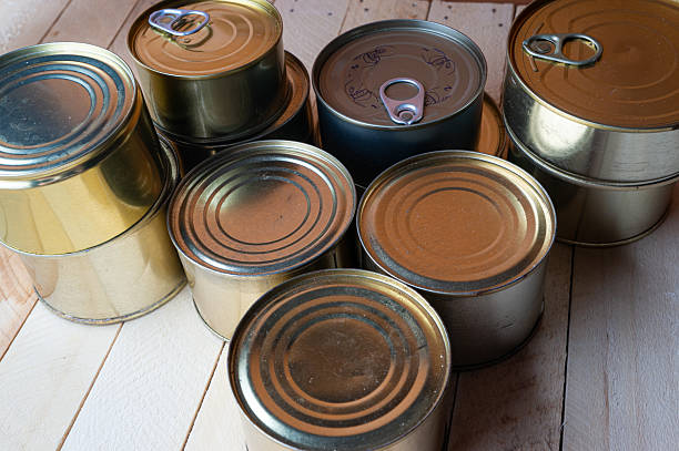 istock Round tin cans with food on the surface 2213190173