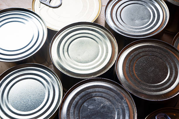 istock Round tin cans with food on the surface 2213190176