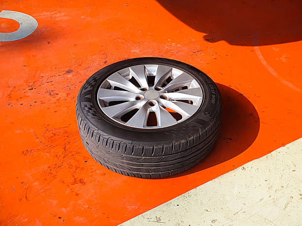 aluminum car wheel with a tire on a SUV