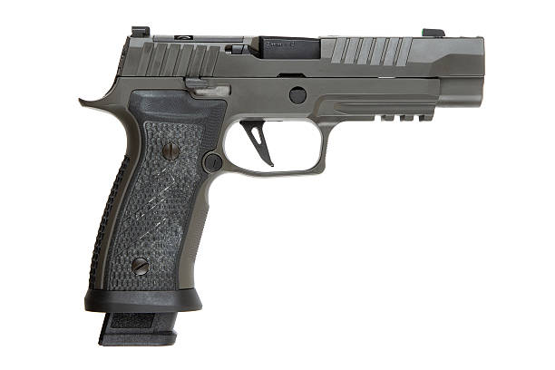 istock Khaki-colored handgun with a textured grip, side view, isolated on a white background, modern firearm design, suitable for self-defense or law enforcement use. 2213199652