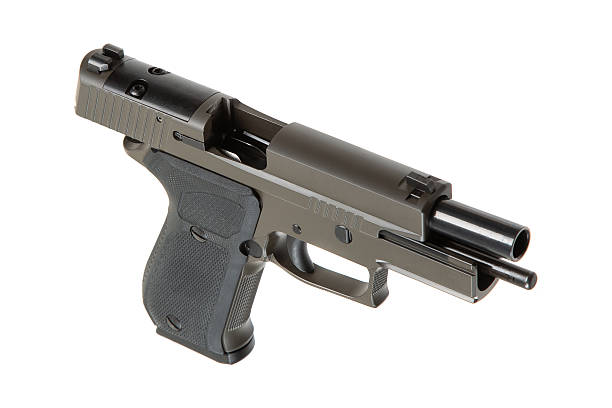 istock Khaki-colored handgun with a textured grip, side view, isolated on a white background, modern firearm design, suitable for self-defense or law enforcement use. 2213199696