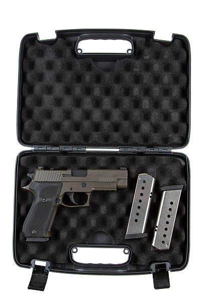 istock Khaki-colored handgun with a textured grip, side view, isolated on a white background, modern firearm design, suitable for self-defense or law enforcement use. 2213199717