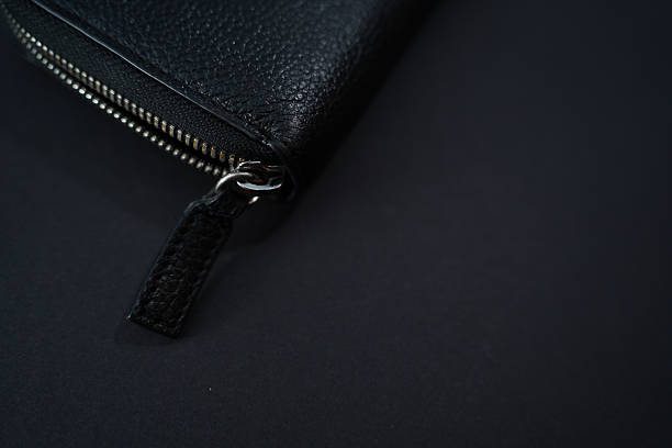 istock Minimalist Black Leather Wallet with Zipper – Close-Up on Dark Background 2213201601