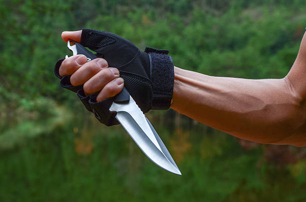 istock Holding a knife in hand 2213201647