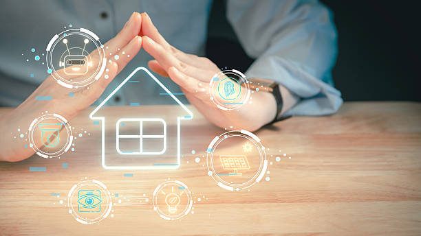istock Hands forming protective gesture over smart home icon with futuristic digital interface representing home automation and security system 2213201806