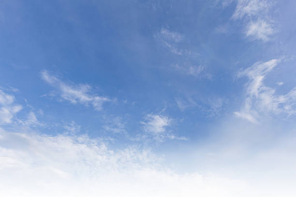 istock Sky blue fluffy clouds vapor air ethereal serene cloudscape shining sunlight vast expanse unobstructed space horizon pure freshness atmosphere dreamy tranquil daytime scene light nature environment. 2213205770