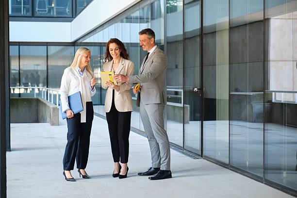 istock Business colleagues using a digital tablet during a meeting outside the office 2213207760
