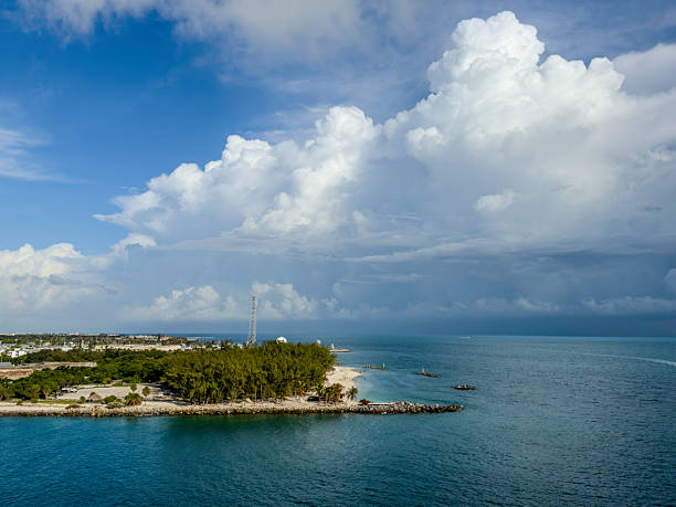 Storm clouds next to key west island appears dramatic and powerful, with a sense of tension in the atmosphere.