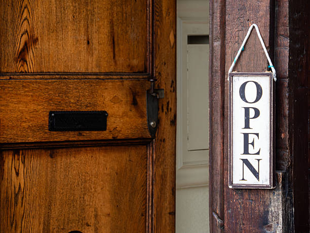 istock OPEN Sign on Wooden Door 2213215154