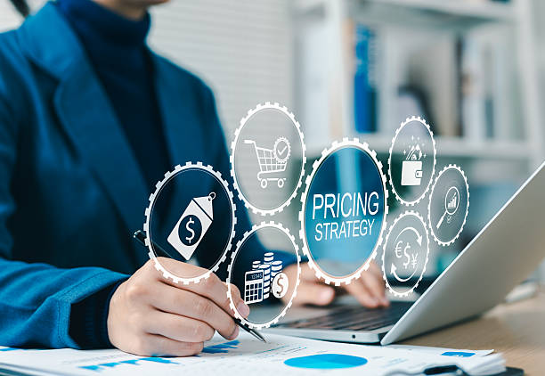 istock Pricing Strategy Analysis and Business Planning Concept. Businessperson working on pricing strategy with icons, cost tags, currency exchange, analysis charts, shopping, and price economic strategy. 2213220847